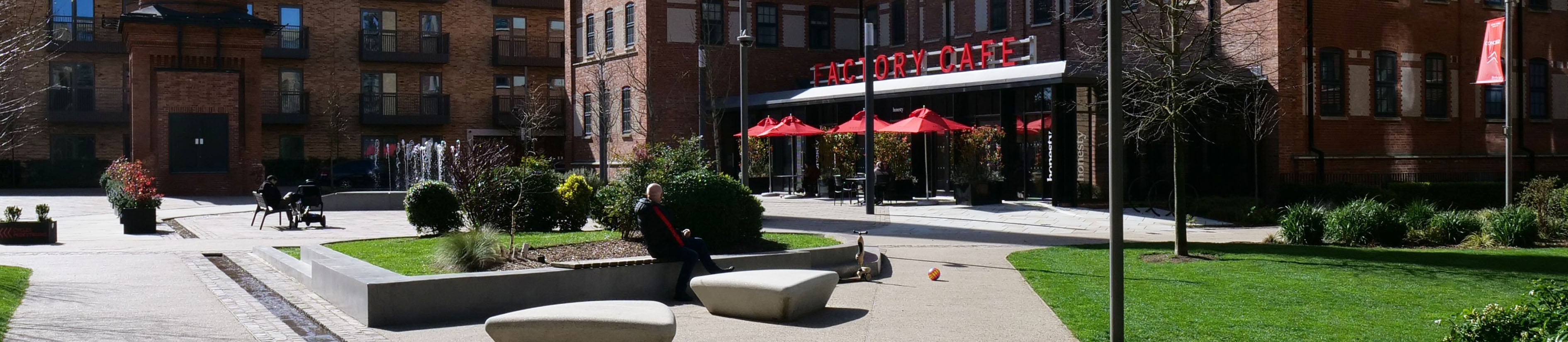 Brick buildings and a landscaped square at the redeveloped Horlicks Factory